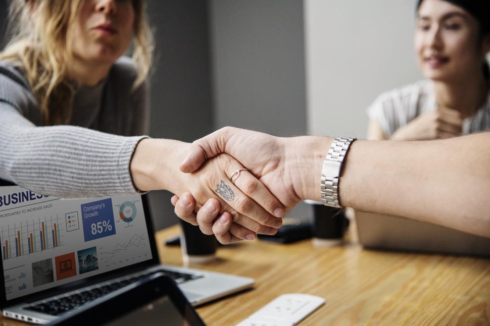 Free Image of Handshake close up over conference table 