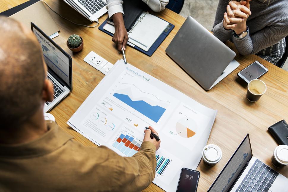 Free Image of Business meeting with carts and graphics 