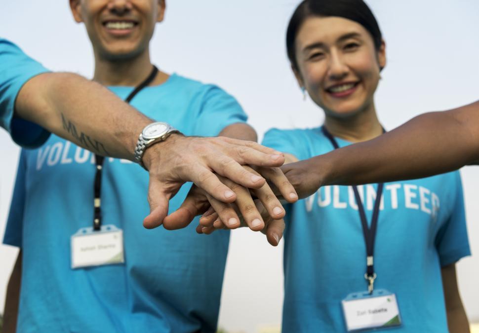 Free Image of Hands stacked together in a small huddle 
