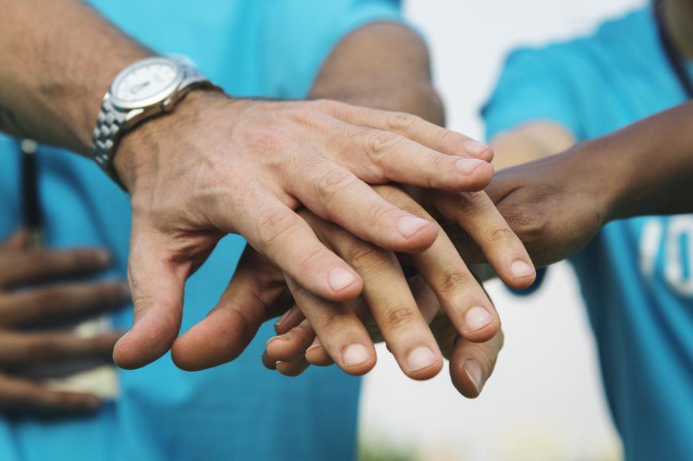 Free Image of Folks with hands stacked together 