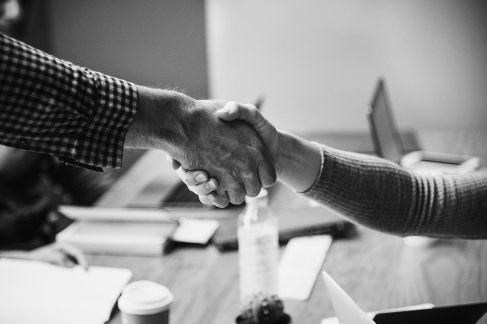 Free Image of Handshake between two people - black and white 