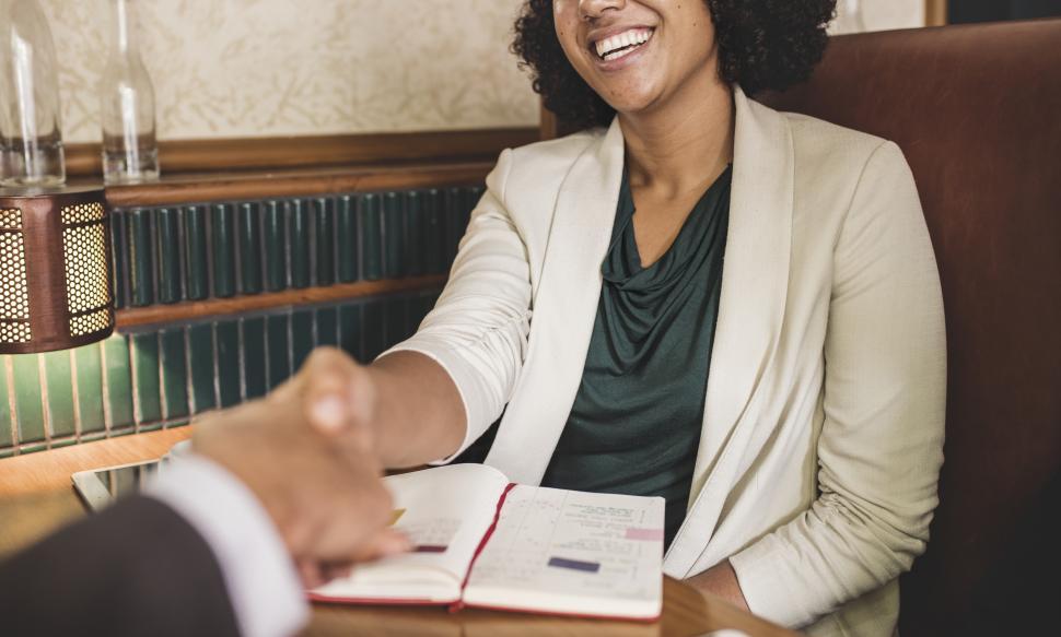 Free Image of Handshake - seated at table 