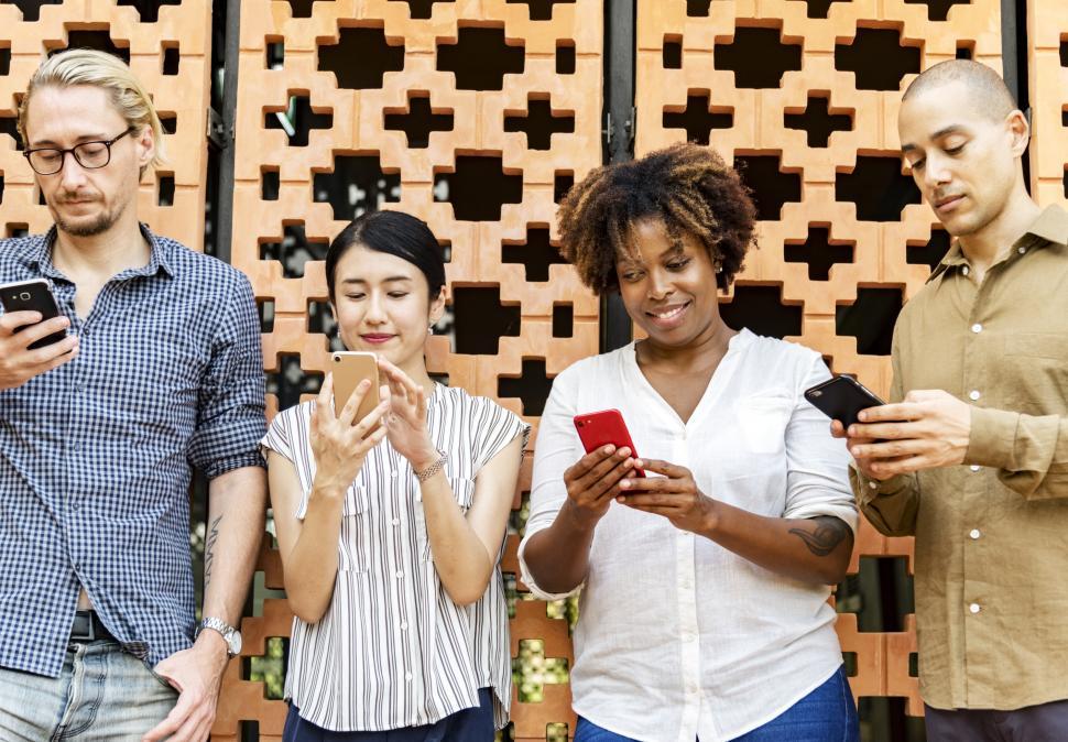 Free Image of Various people looking at their mobile phones 