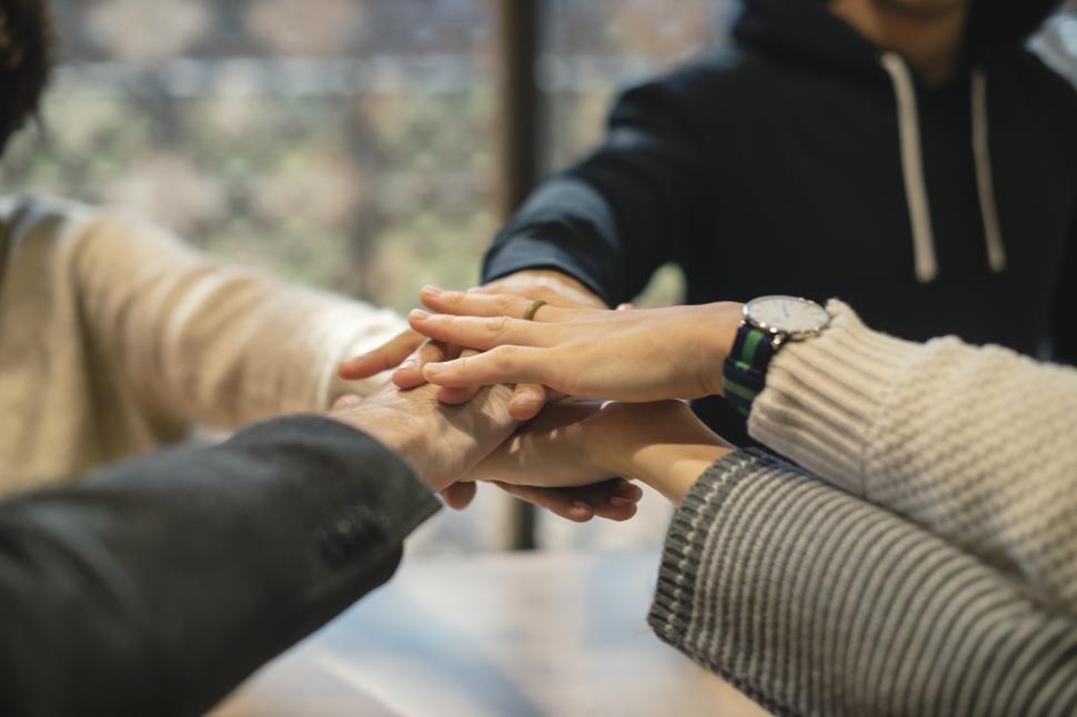Free Image of Stack of hands, showing unity 