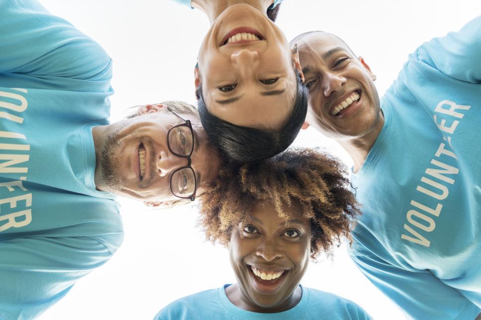 Free Image of Low angle view looking up at a volunteers huddle 