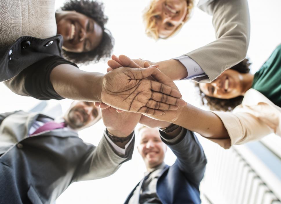 Free Image of Group of people with hands in the middle - huddle 