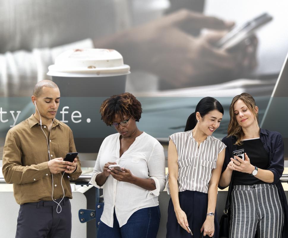 Free Image of Group of people looking at their mobile phones 