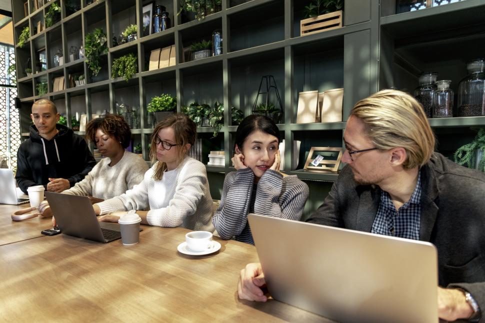 Free Image of Row of people working at a cafe 