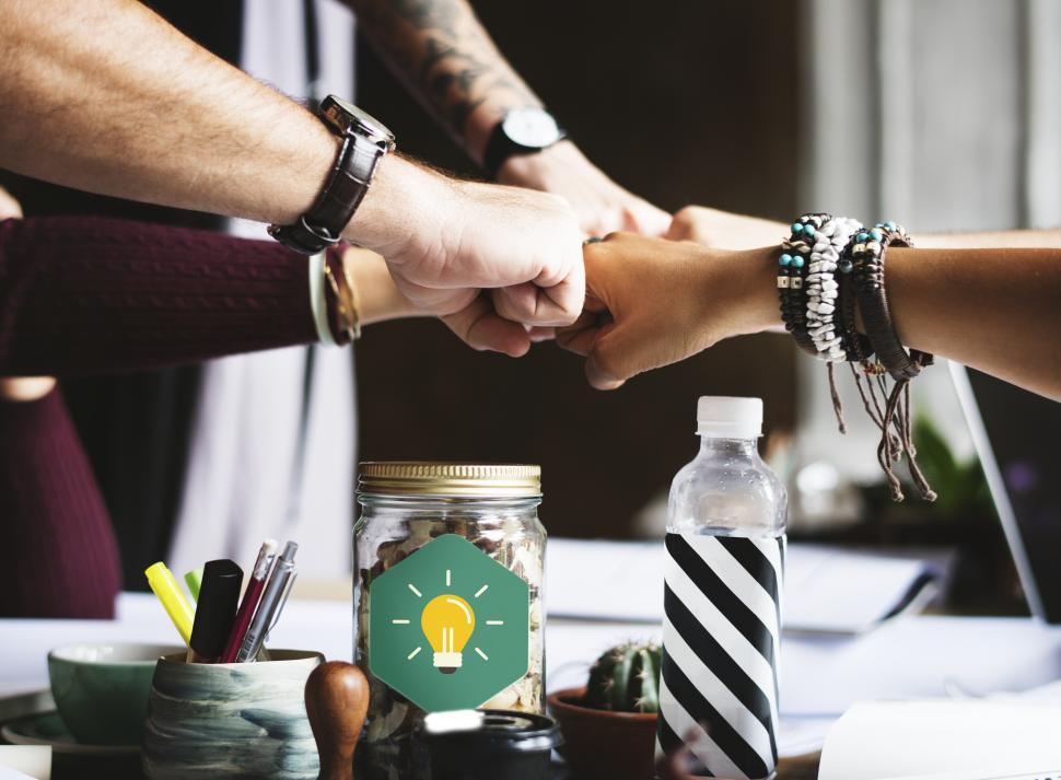 Free Image of A business team giving group Fist Bump in agreement 