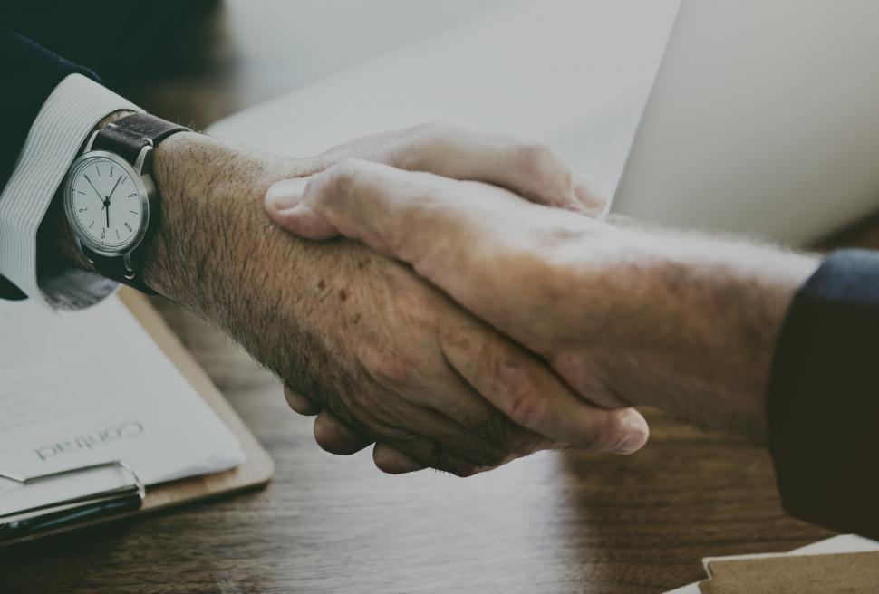 Free Image of businessmen handshaking after good deal 