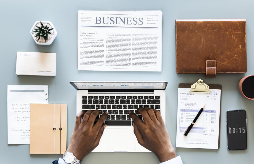 Free Image of Overhead view of a person s hand typing on laptop 