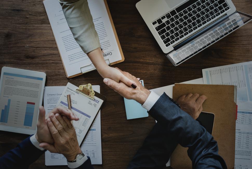 Free Image of Handshake across desk -  two business people 
