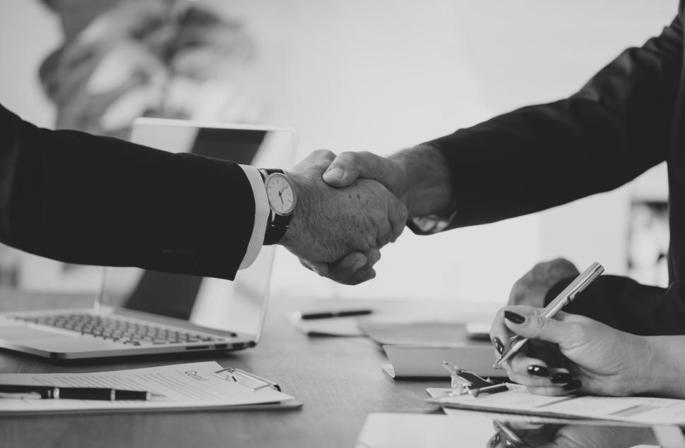 Free Image of Firm Handshake between two people 