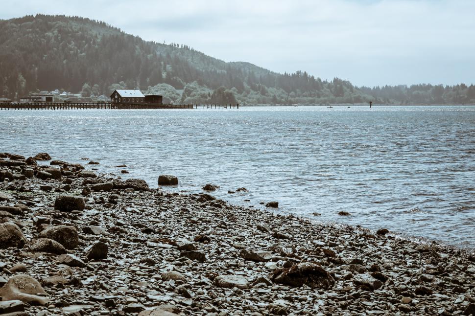 Free Image of Cold tint of pier and buildings at the beach 