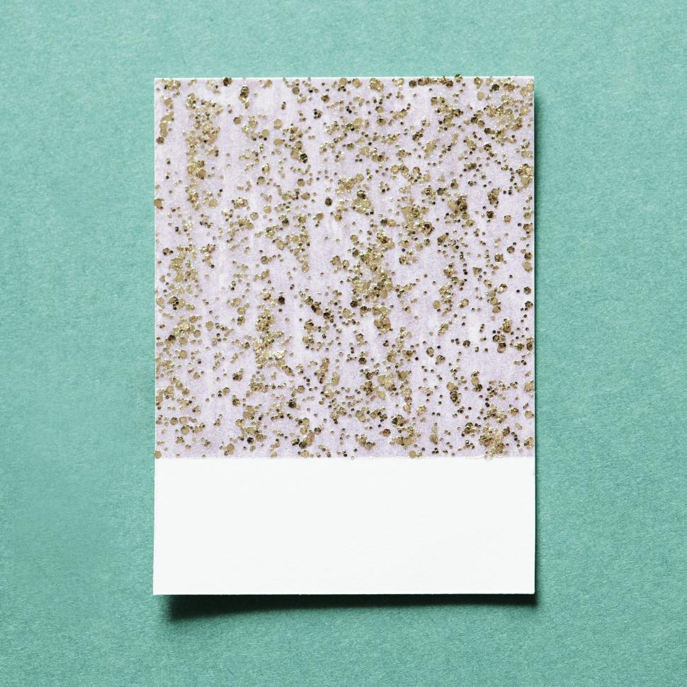 Free Image of Flat lay of glitter sparkles on spaced cardboard frame 
