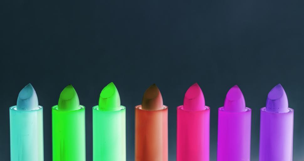 Free Image of Color inverted image of bright colorful twisted up lip balm sticks 