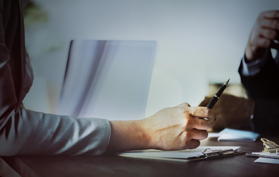Free Image of Close up of a persons hand holding a pen 
