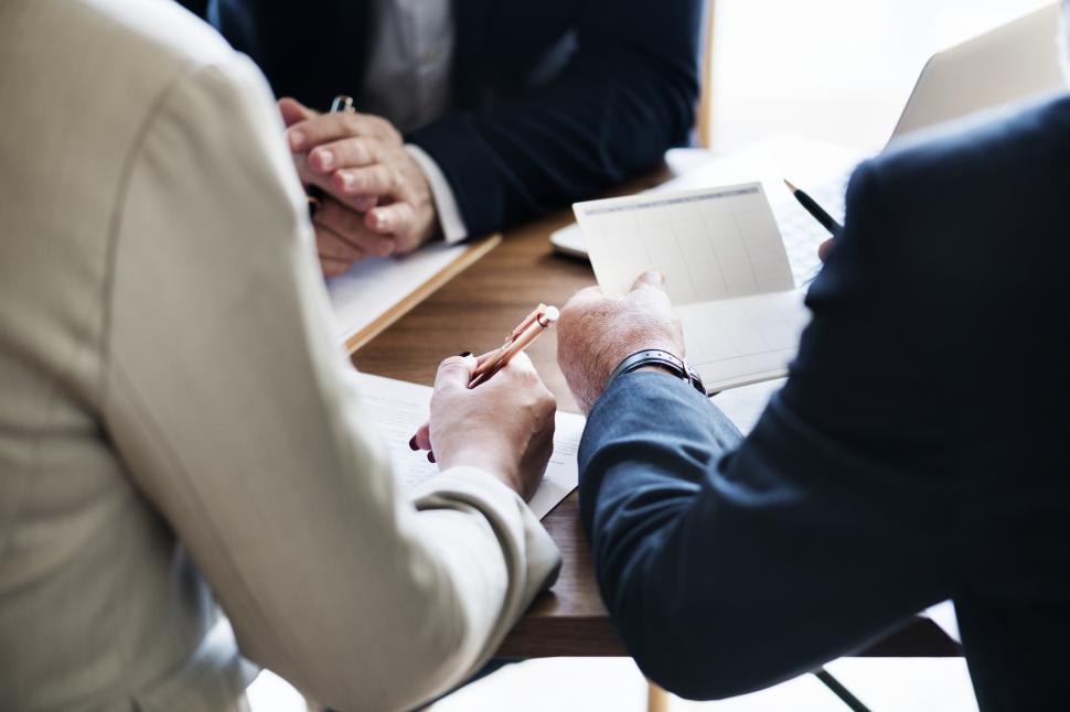 Free Image of Anonymous businesspeoples hands in a meeting 