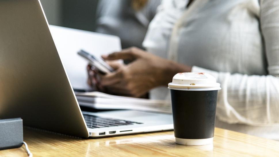 Free Image of Close up of a coffee mug on the table at work 