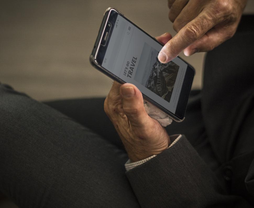 Free Image of Person tapping on content on a mobile phone 