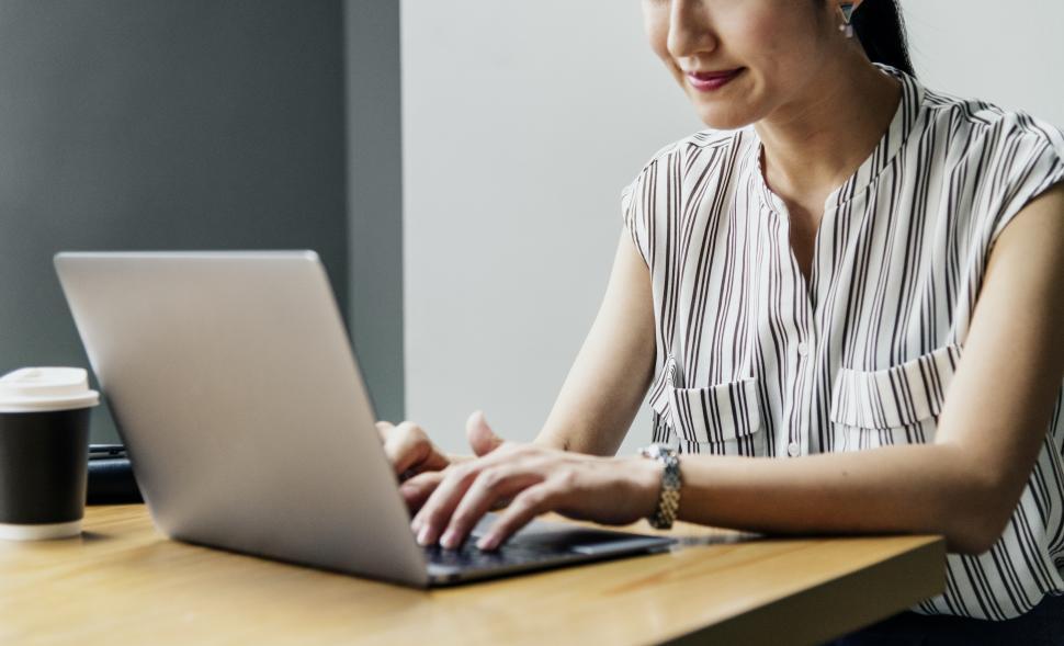 Free Image of Woman working on computer - partially obscured 
