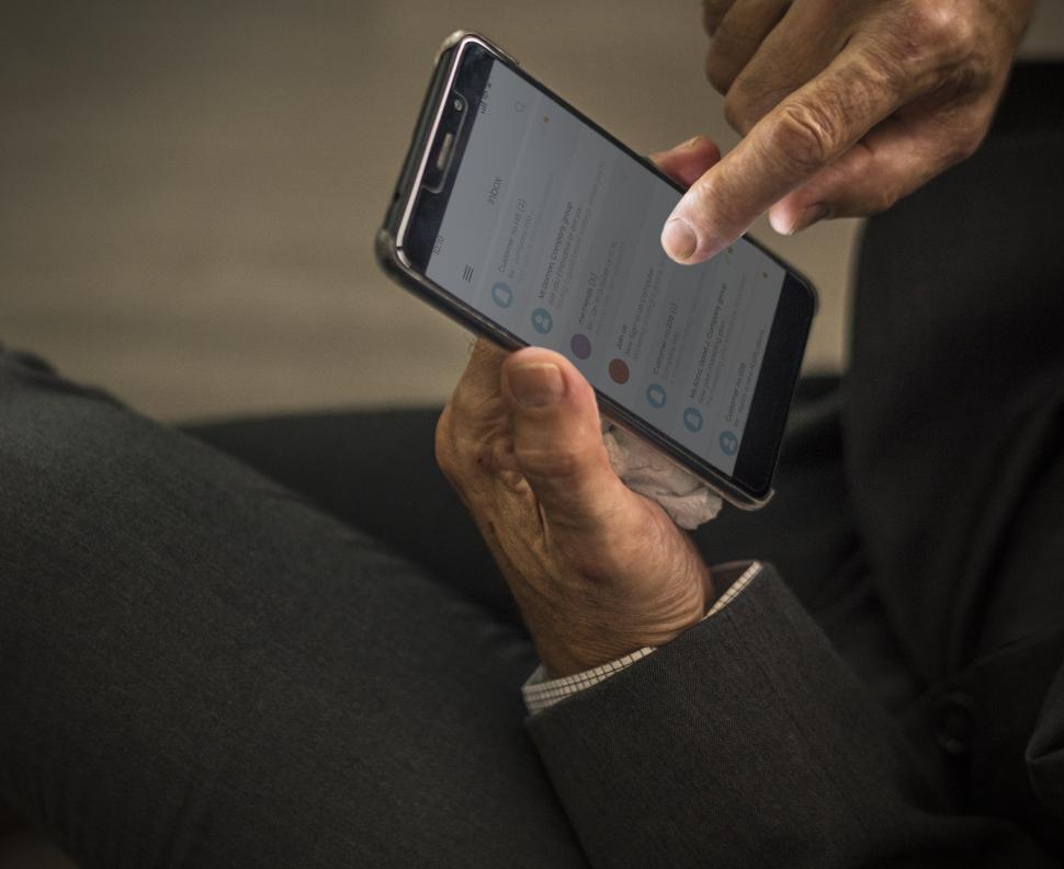 Free Image of Tapping on a mobile phone screen 