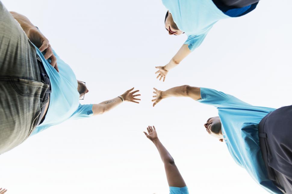 Free Image of Low angle view looking up at a volunteers breaking from huddle 