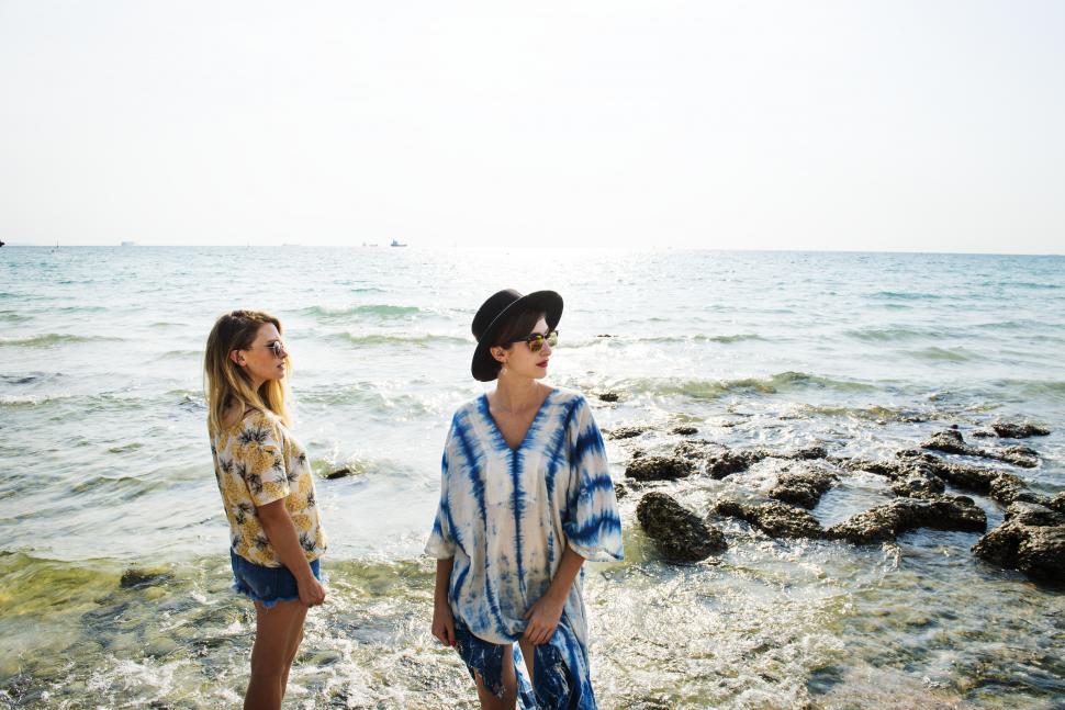 Free Image of Two young women posing by the sea 