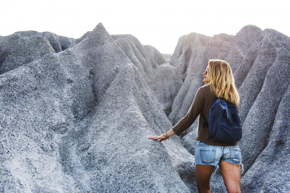 Free Image of A young caucasian woman on a steep hike 
