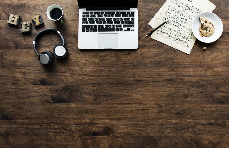 Free Image of Overhead view of a laptop and an audio headset with copyspace 