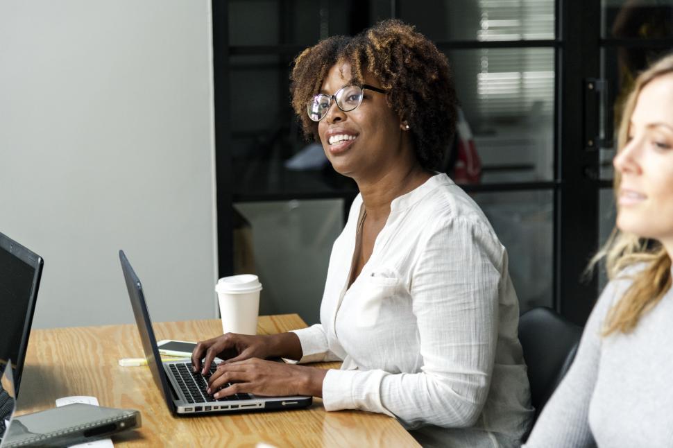 Free Image of An African ethnicity woman with her colleague in a business meeting 