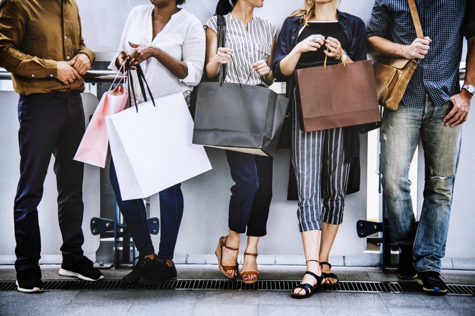 Free Image of Shopping bags and a group of multiethnic shoppers 
