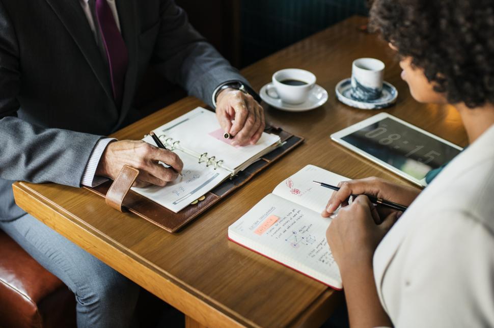 Free Image of Hands and table of people at a cafe 