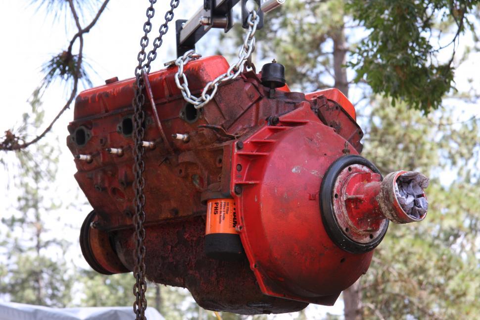 Free Image of Hoisting boat engine 