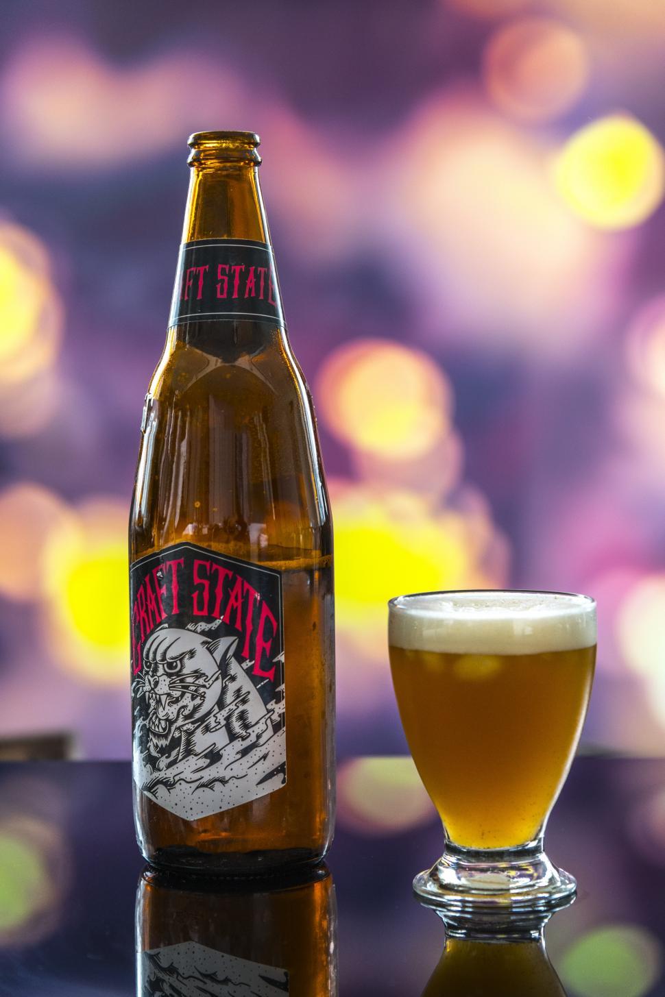 Free Image of Close up of a beer glass and a bottle 