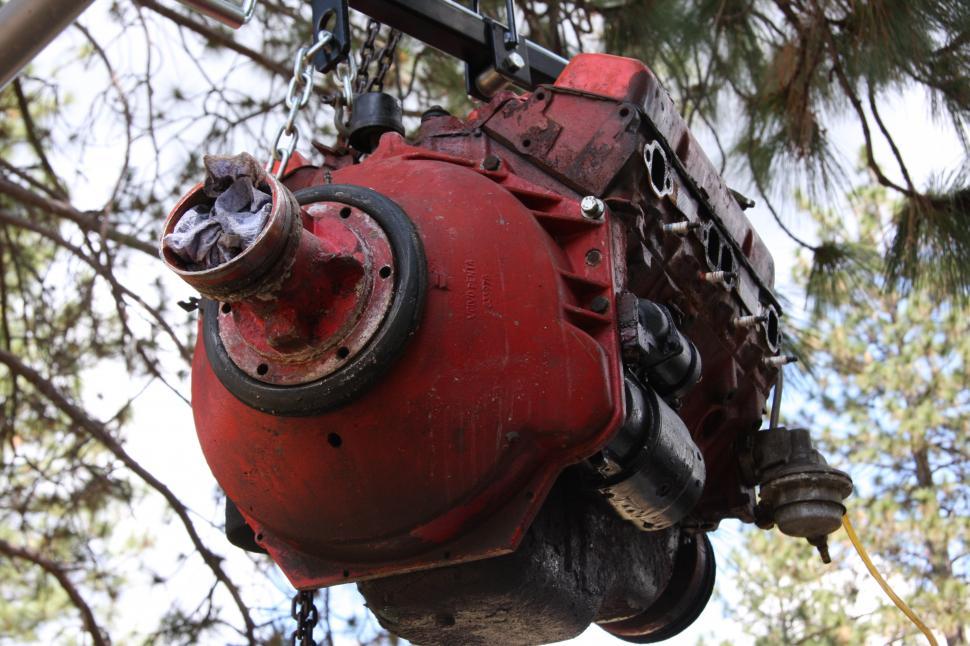 Free Image of Hoisting boat engine 
