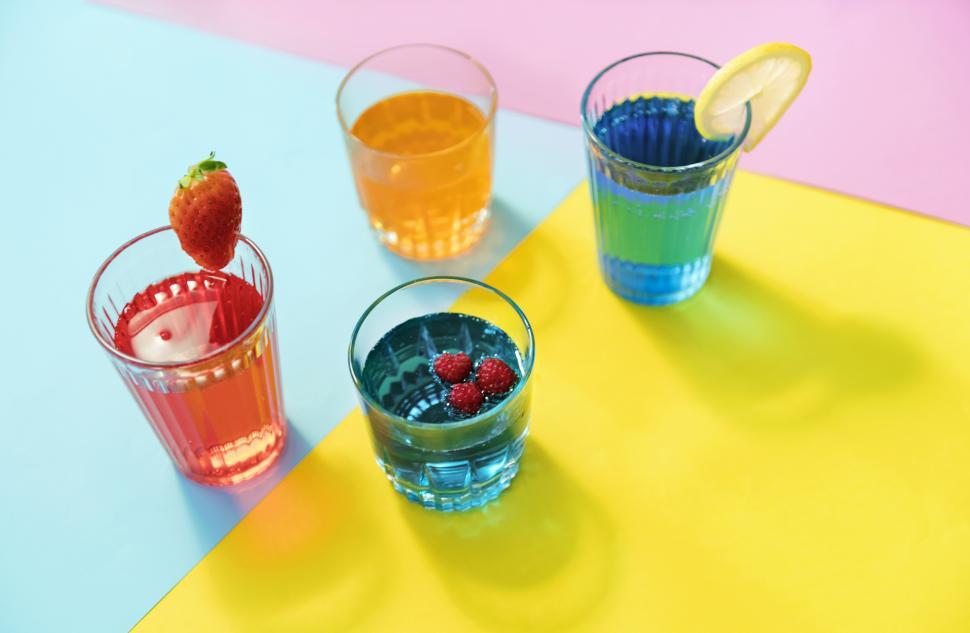 Free Image of Close up of colorful beverages in four glasses 