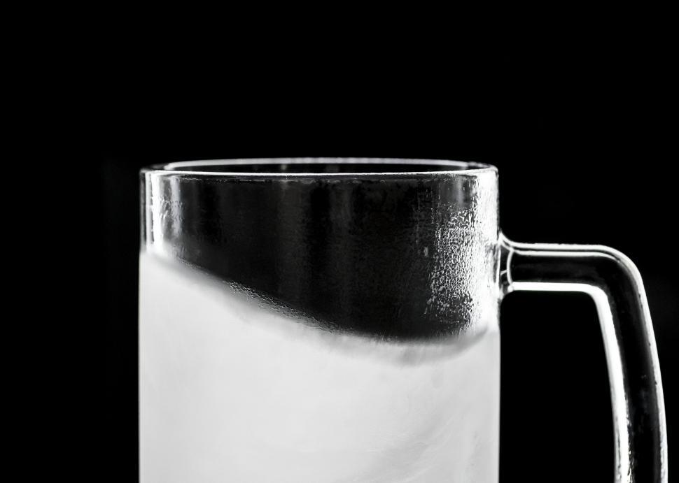 Free Image of Close up of frosted beer served in clear pint mug 