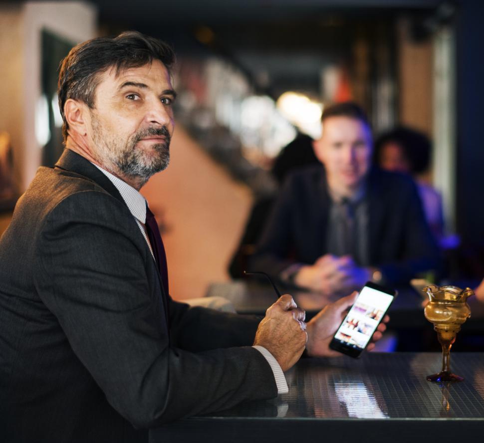 Free Image of Close up of a senior businessman with his colleagues 