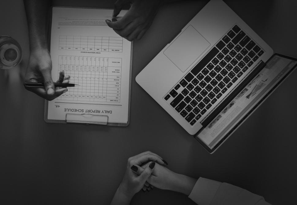 Free Image of Overhead view of a doctor hand checking schedule 