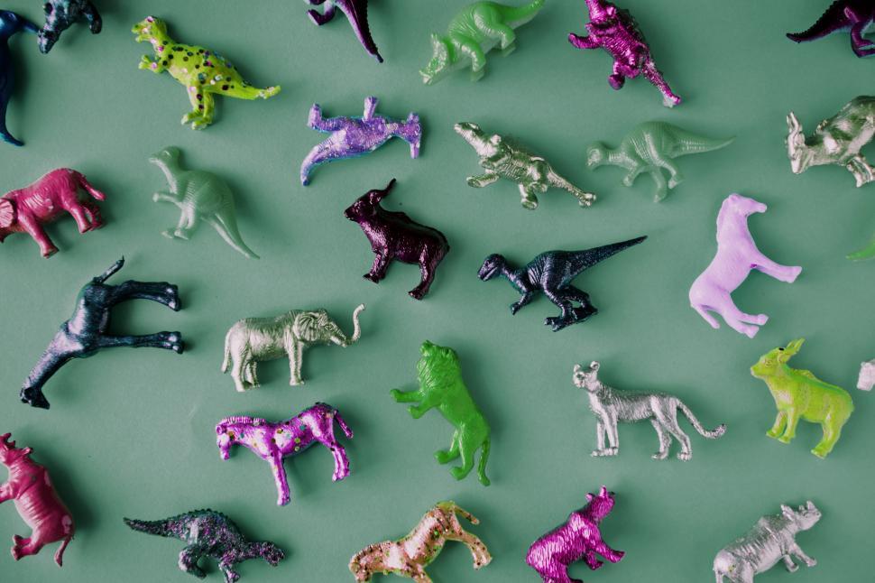 Free Image of Colorful toy animals on green surface 