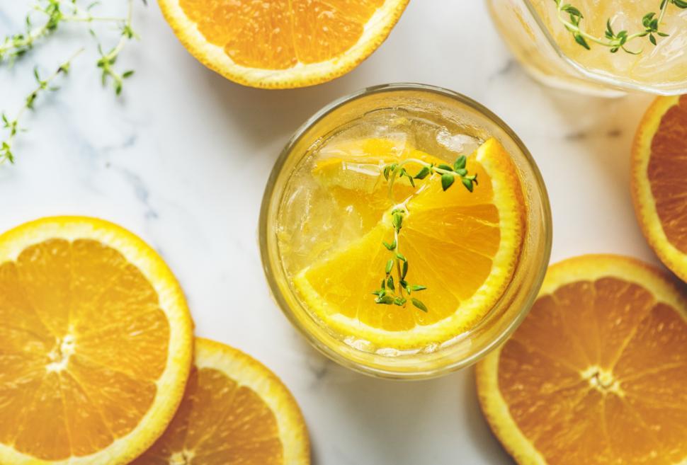 Free Image of Overhead view of chilled beverage in glasses garnished with orange slices 