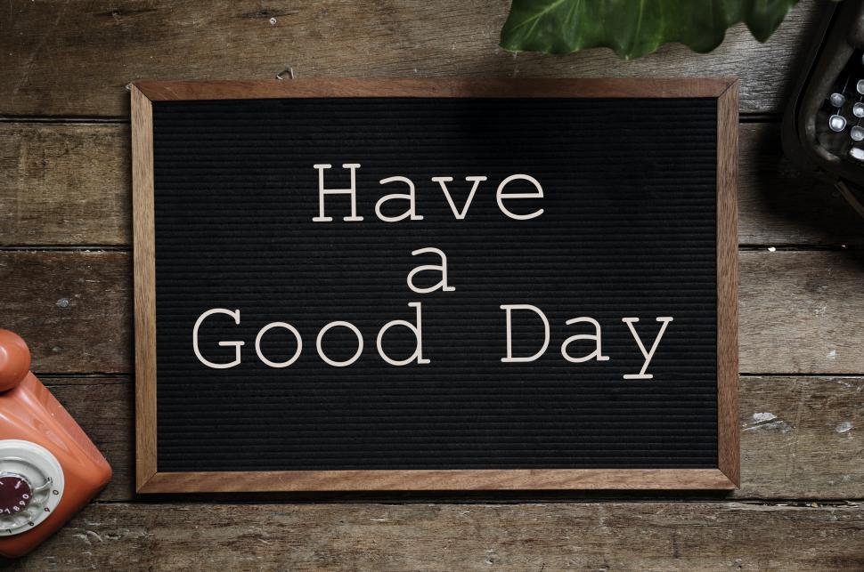 Free Image of Overhead view of text Have a Good Day arranged on an old bulletin board 