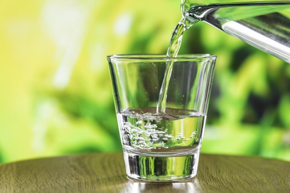 Free Image of Filling a water glass on the table 