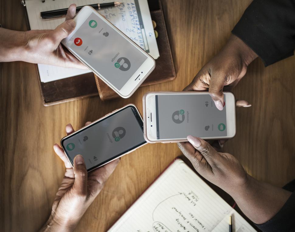 Free Image of Close up of group hands holding mobile phones 