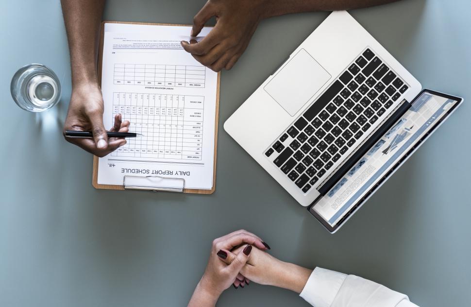Free Image of Overhead view of a doctor checking report schedule 