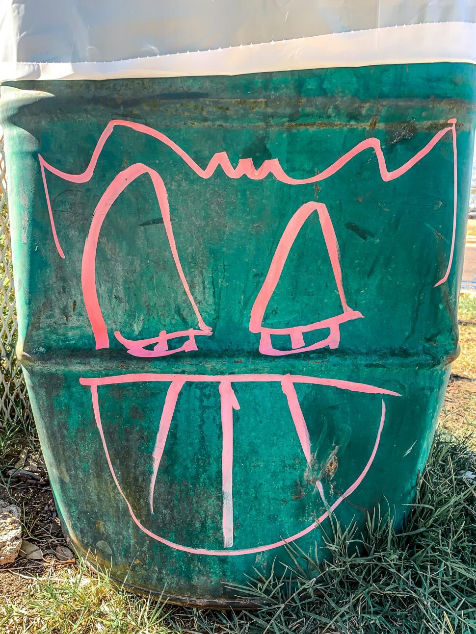 Free Image of Strange Smiliing Face on Garbage Can 