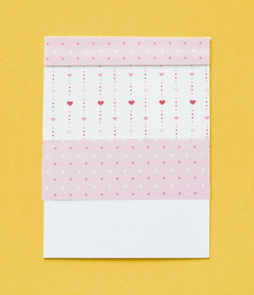 Free Image of Flat lay of heart design pattern on spaced cardboard frame 