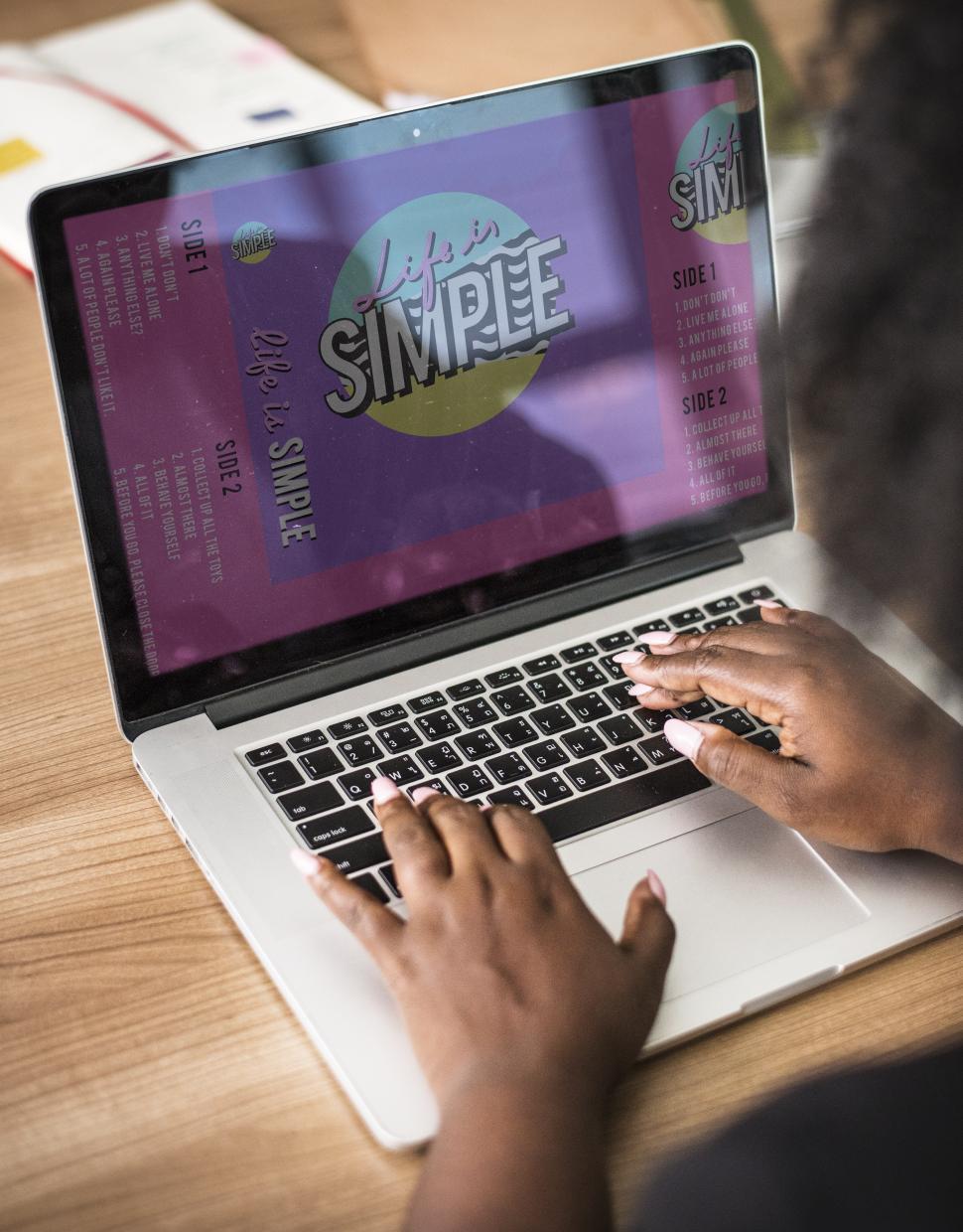 Free Image of Close up of a woman s hands typing on the laptop 