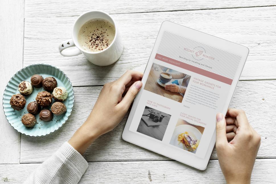 Free Image of Overhead view of a hand holding a tablet PC 